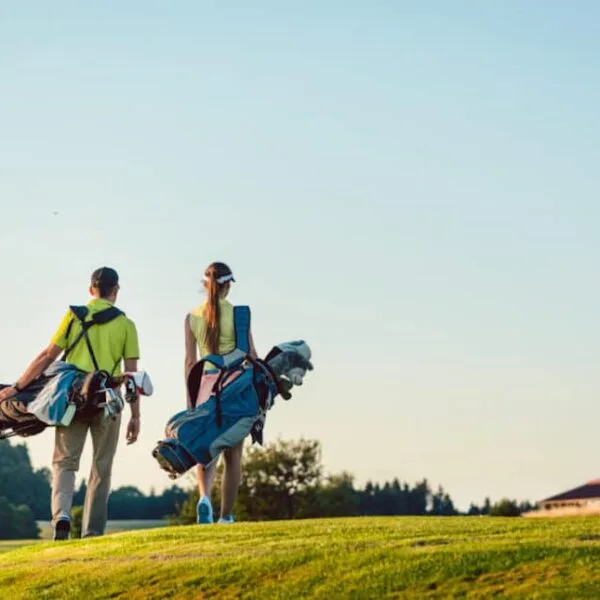couple-walking-on-golf-course-1