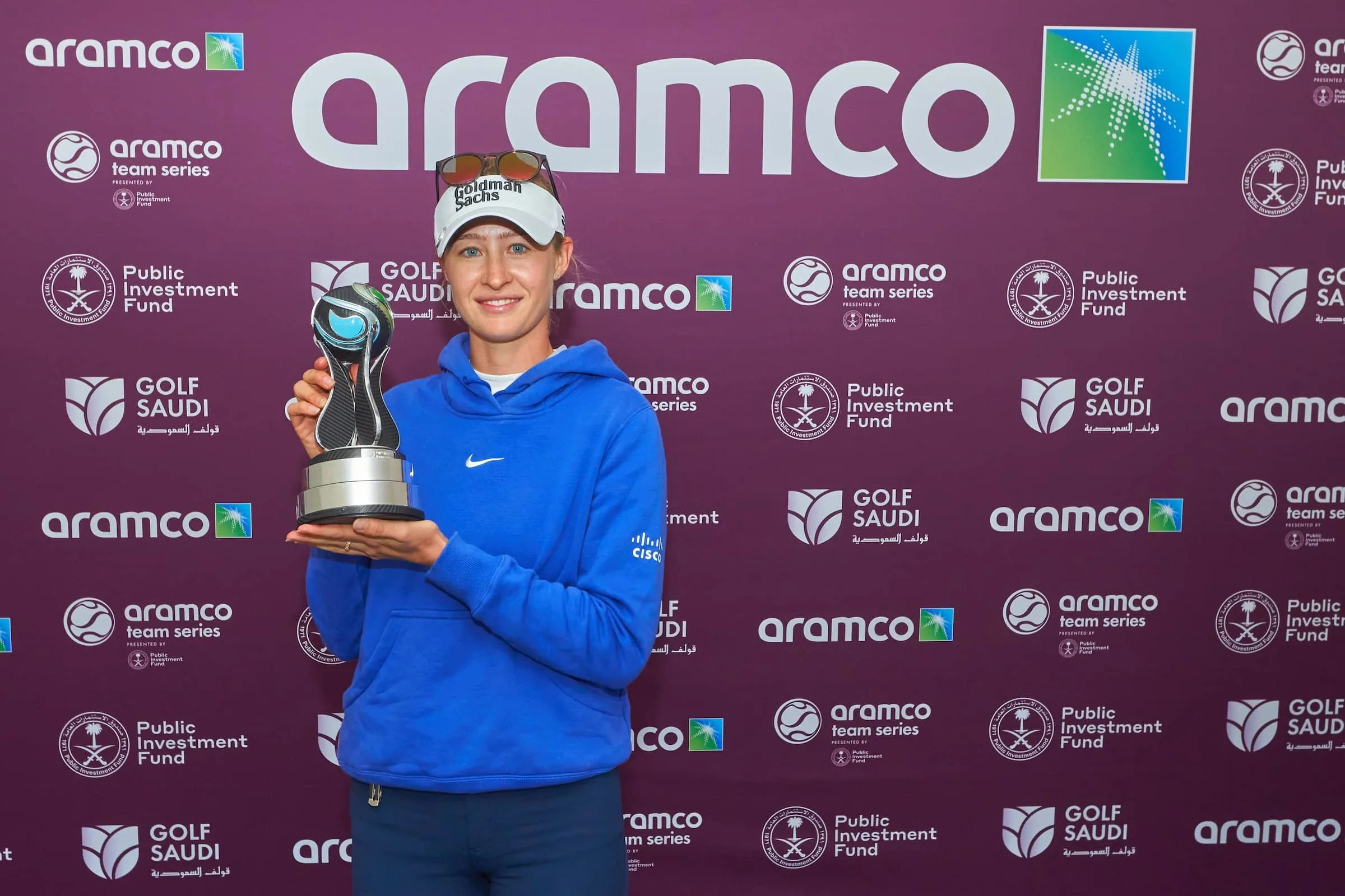 Nelly-Korda-with-Aramco-trophy