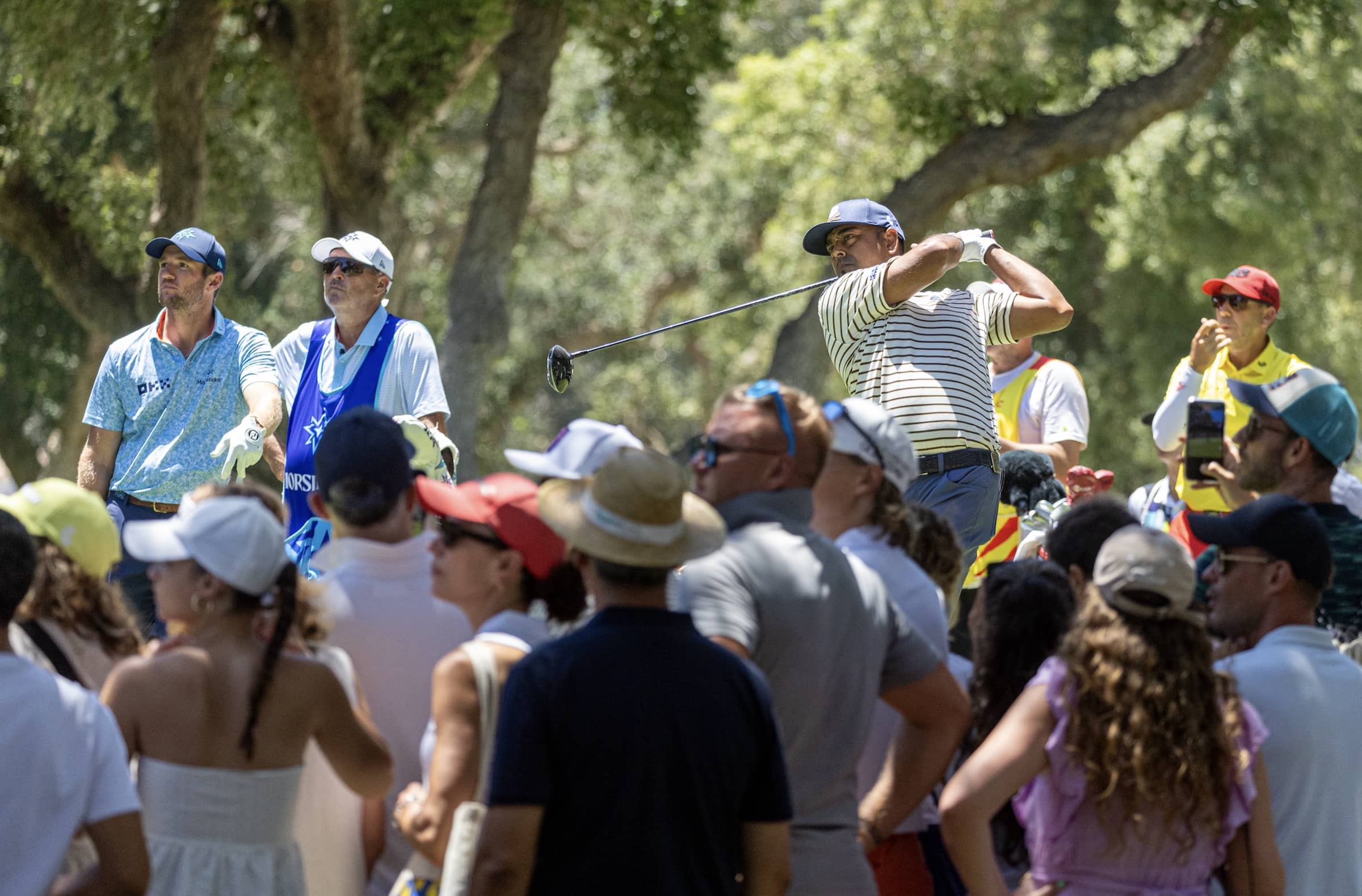 Anirban Lahiri of Crushers GC hits his shot from the ninth tee during the second round of LIV Golf Andalucía at Real Club Valderrama.