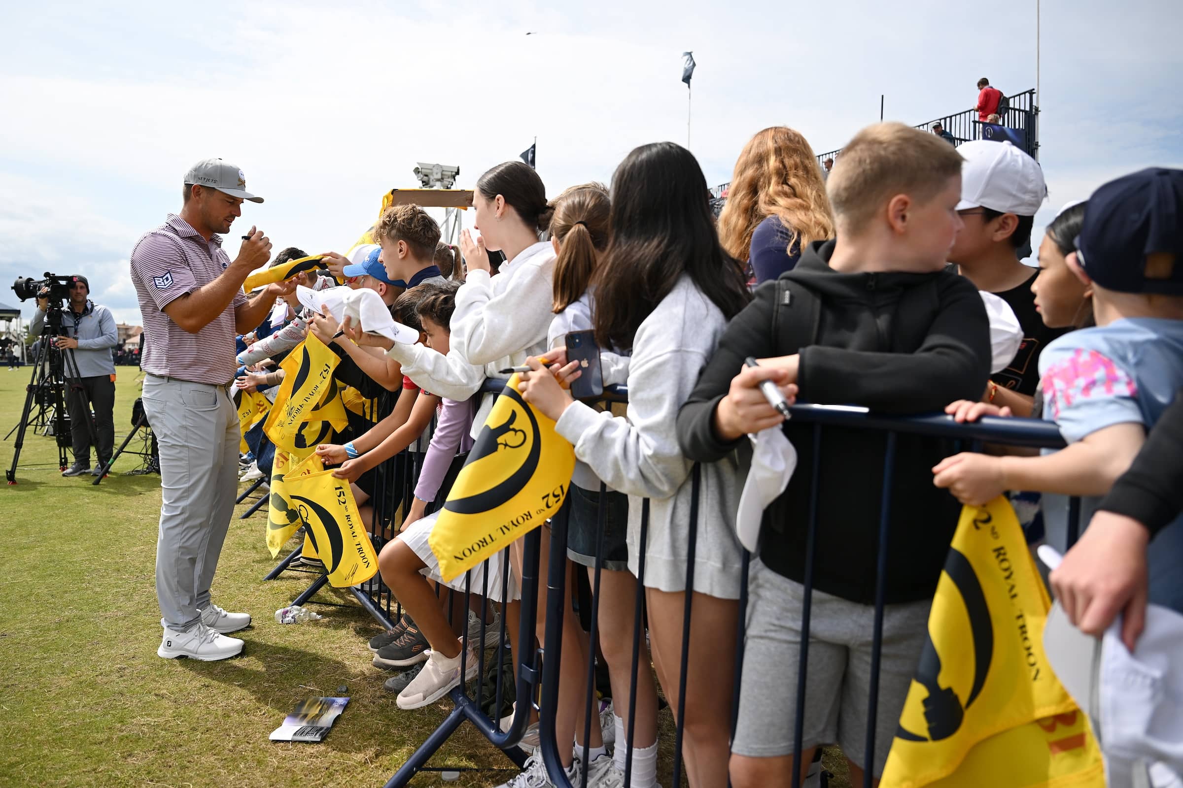 Bryson DeChambeau signs autographs for fans