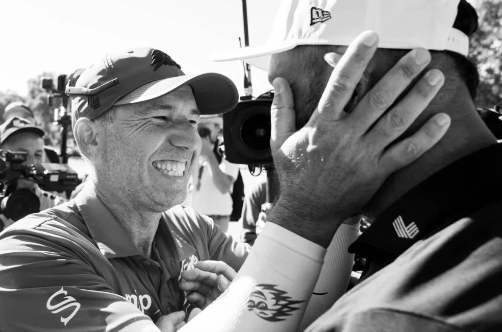 First place individual champion, Captain Sergio Garcia of Fireballs GC interacts with Captain Jon Rahm of Legion XIII after the final round of LIV Golf Andalucía.