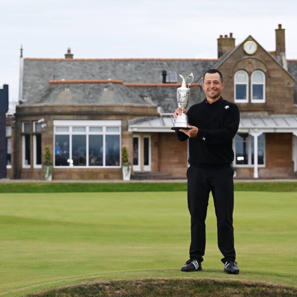 Xander Schauffele lifts the Claret Jug on the 18th green in celebration of victory on day four of The 152nd Open championship at Royal Troon