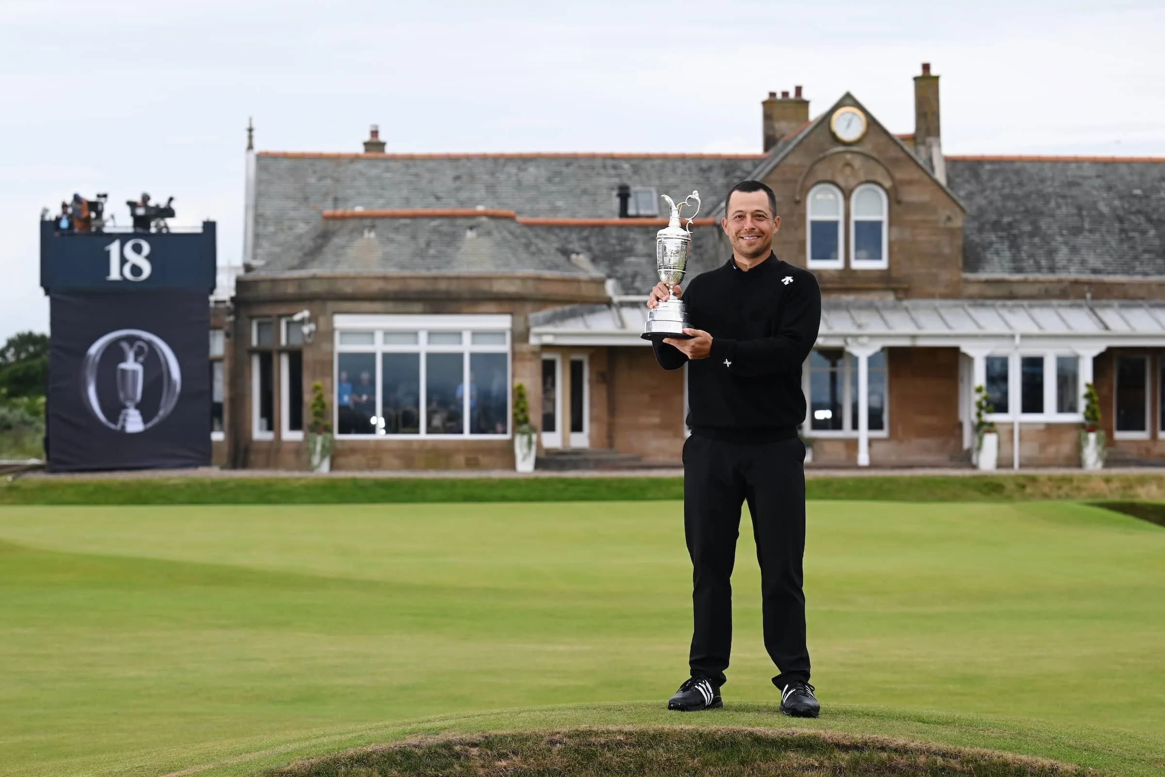Xander Schauffele lifts the Claret Jug on the 18th green in celebration of victory on day four of The 152nd Open championship at Royal Troon