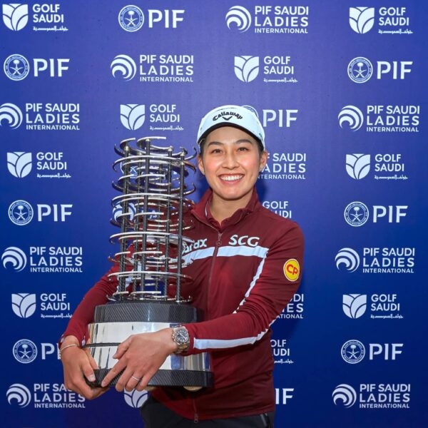 Jeeno Thitikul scoops up the trophy after three days at Riyadh Golf Club
