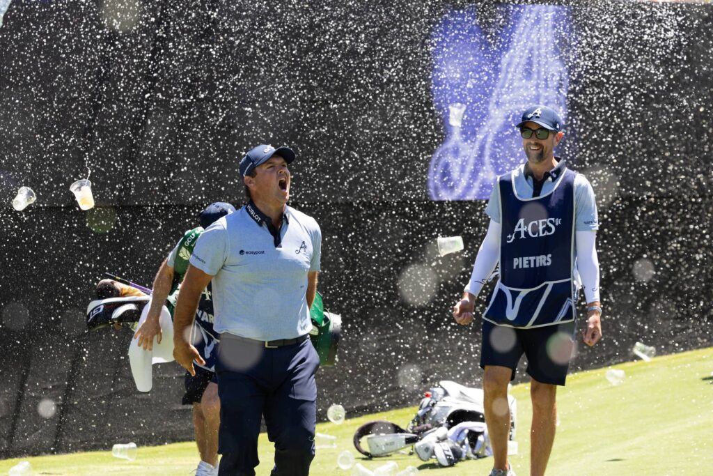 Patrick Reed of 4Aces GC reacts to his hole-in-one on the 12th hole during the first round of LIV Golf Adelaide at Grange Golf Club
