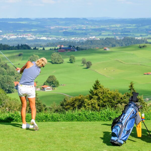 Couple about to tee off on golf course