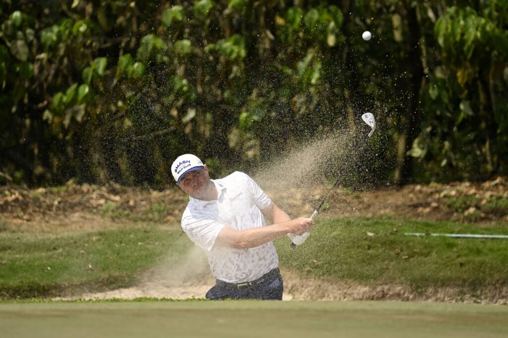 Jason Kokrak plays out of the bunker at Macau Golf and Country Club during International Series Macau