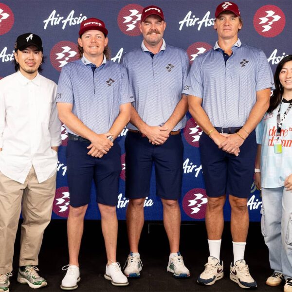 AirAsia stewardesses pose for a photo with CEO of AirAsia Brand Co., Ruby Khaw, Captain Cameron Smith of Ripper GC, Marc Leishman of Ripper GC, Ripper GC Nick Adams and guests at a Ripper GC and AirAsia announcement before the start of LIV Golf Singapore at Sentosa Golf Club, Singapore.