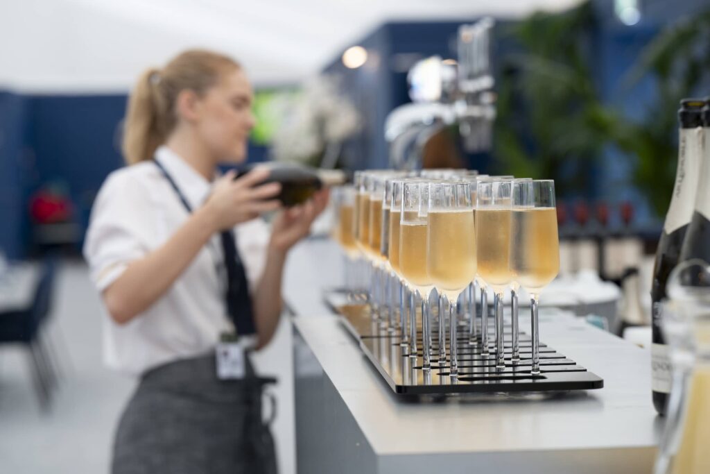 Champagne being poured at The Open