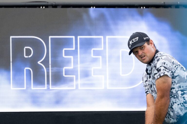 Patrick Reed of 4Aces GC lines his shot from the first tee during the first round of LIV Golf Miami at Trump National Doral