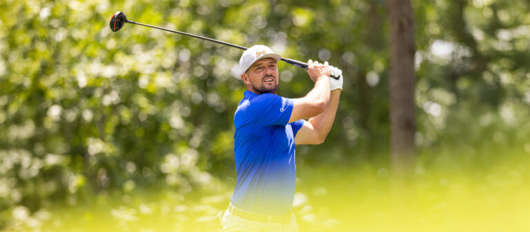 Captain Bryson DeChambeau of Crushers GC hits his shot from the fifth tee during the first round of LIV Golf Virginia