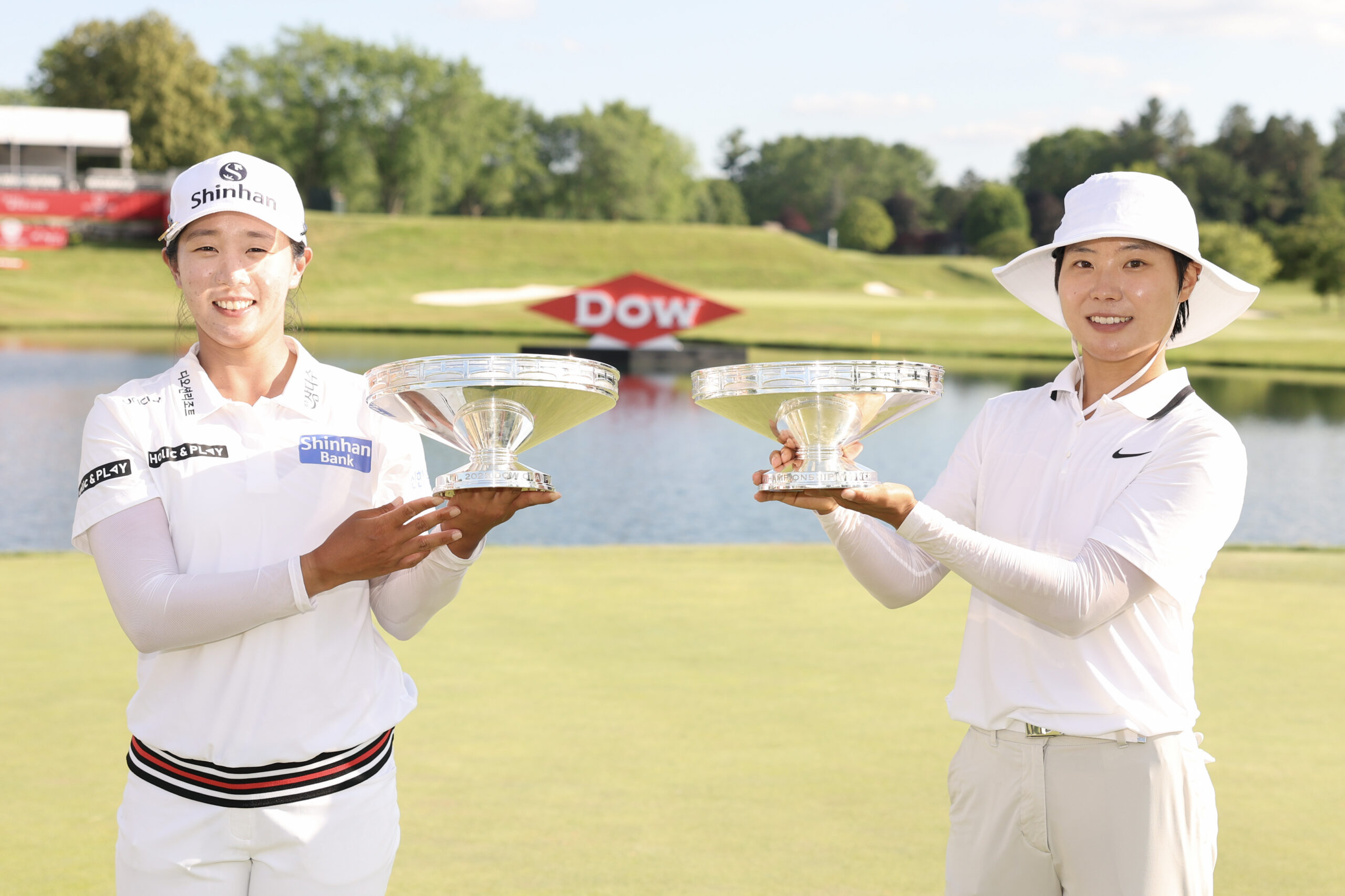 Jin Hee Im and Somi Lee of South Korea pose with their trophies after the final round of the Dow Championship 2025 at Midland Country