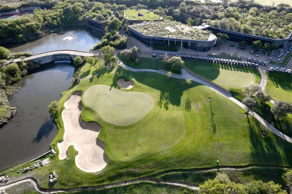 An aerial view of the 9th green and clubhouse at The Club at Steyn City
