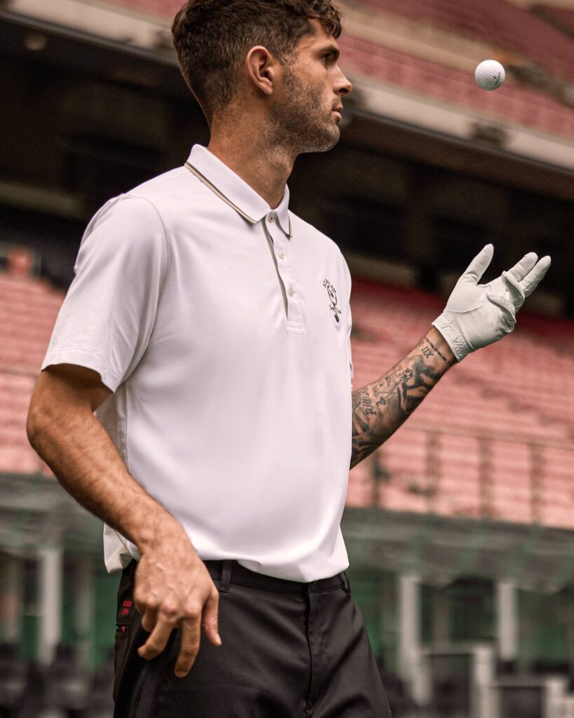 Christian Pulisic wearing the latest PUMA AC Milan Golf Shirt