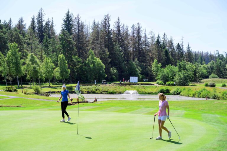 Golfers on green