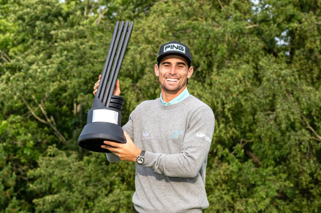 First place individual champion, Captain Joaquín Niemann of Torque GC poses with the trophy after the final round of LIV Golf United Kingdom at JCB Golf & Country Club