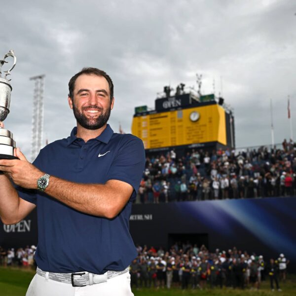 Scottie Scheffler of the United States lifts the Claret Jug