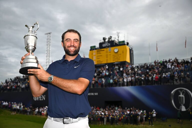 Scottie Scheffler of the United States lifts the Claret Jug