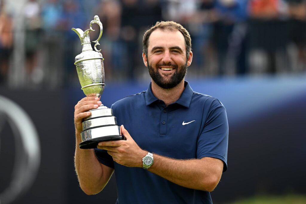Scottie Scheffler of the United States lifts the Claret Jug on the 18th green