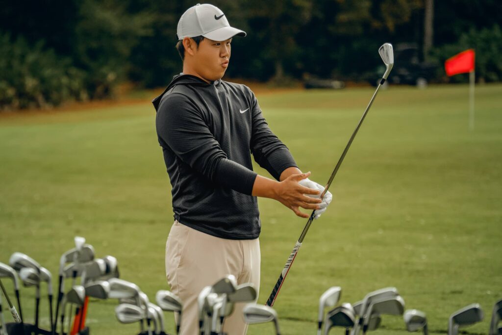 Tom Kim checking out Titleist T-Series Irons
