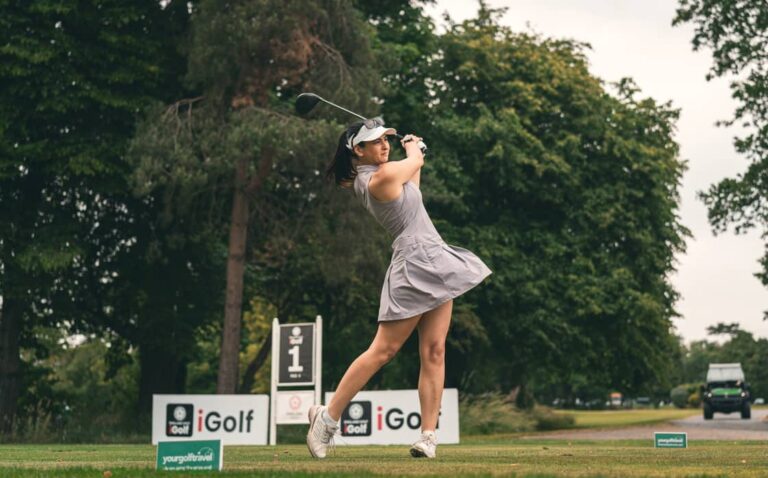 Woman Golfer Tees Off on First Tee