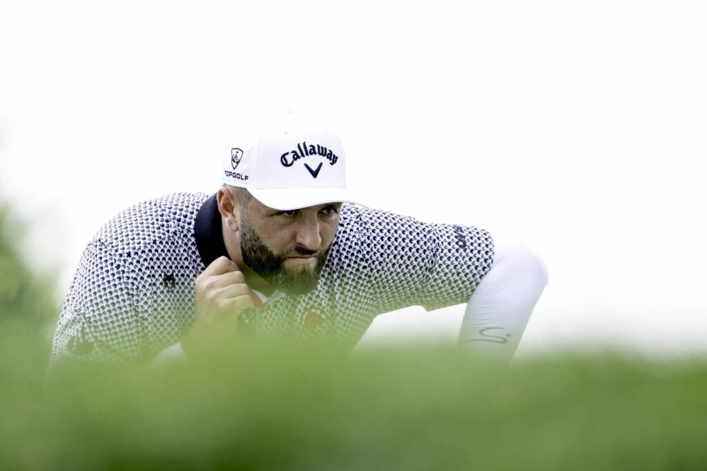 Captain Jon Rahm of Legion XIII reads his putt on the fifth green during the first round of LIV Golf Indianapolis