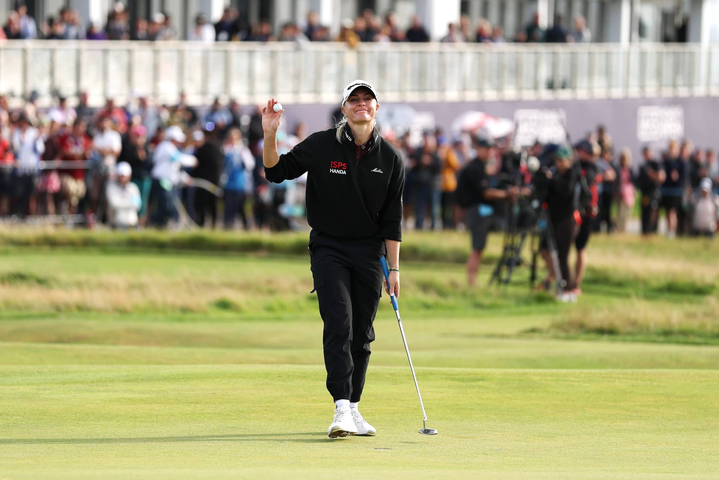 Charley Hull acknowledges the crowd on the 18th green