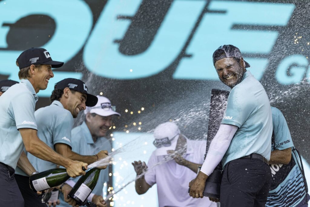 First place individual champion, Sebastián Muñoz celebrates with Carlos Ortiz, Captain Joaquín Niemann , and caddie, Jose Campra Scott Taetsch:LIV Golf