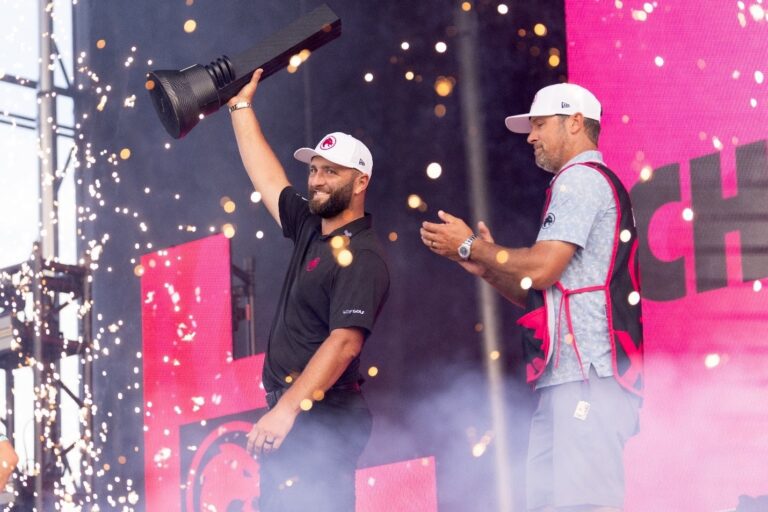 Jon Rahm lifts the Chicago trophy