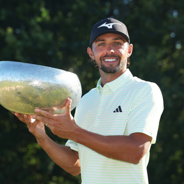 Marco Penge of England poses for a photo holding the trophy on the 18th hole after winning the Danish Golf Championship 2025 at Furesø Golfklub Birkerod, Denmark.