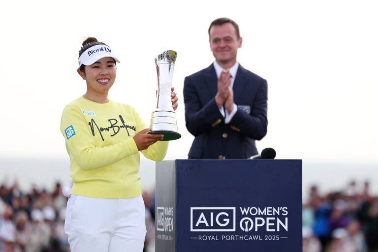Miyu Yamashita of Japan lifts the AIG Women's Open trophy on the 18th green following the final round of the AIG Women's Open 2025 at Royal Porthcawl Golf Club