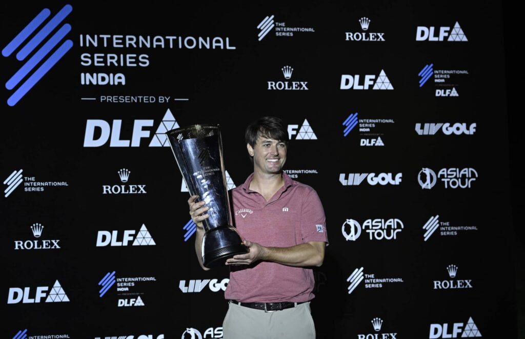 Ollie Schniederjans of the USA pictured with the winner’s trophy after round four of International Series India