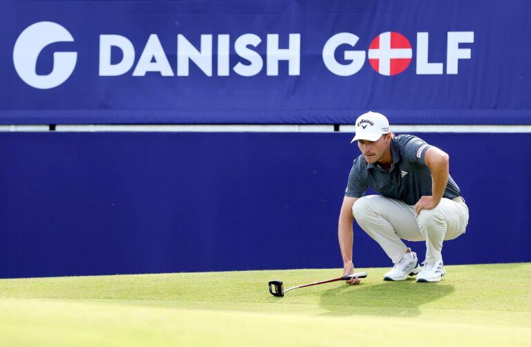 Rasmus Hojgaard of Denmark lines up a putt on the 18th green on day three of the Danish Golf Championship 2025 at Furesø Golfklub