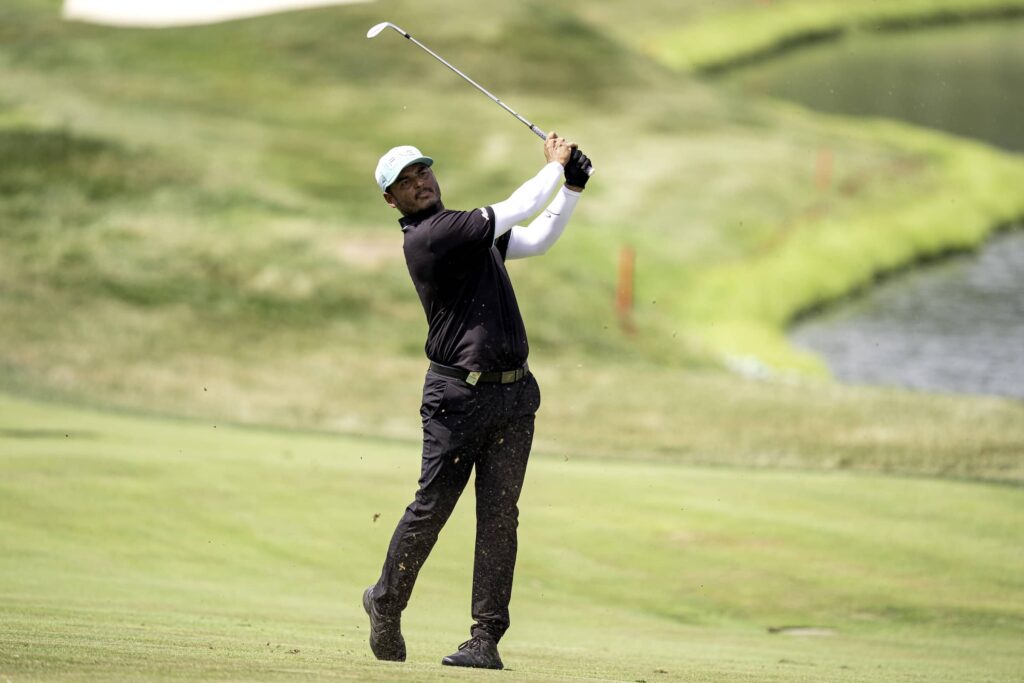 Sebastián Muñoz of Torque GC hits his shot from the 15th fairway during the second round of LIV Golf Indianapolis 