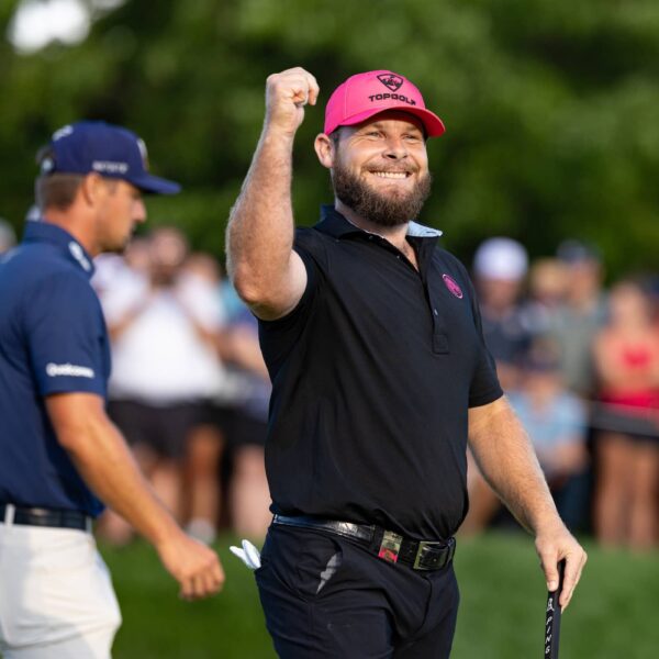Tyrrell Hatton of Legion XIII smiles in reaction to his putt on the 18th green during the final round of LIV Golf Team Championship Michigan at The Cardinal at Saint John’s