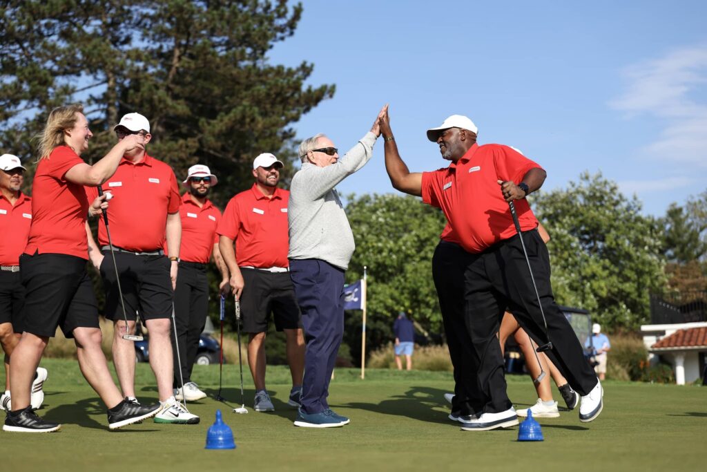 Tamari Watkins high five with Jack Nicklaus