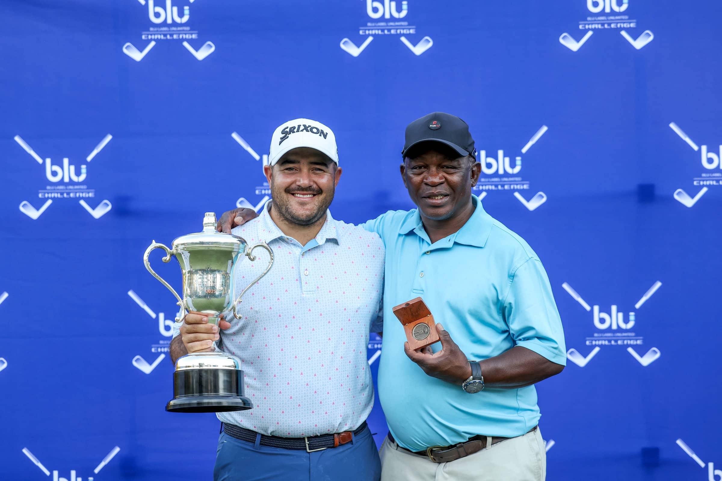 Hennie du Plessis with his caddie, Zack Rasego