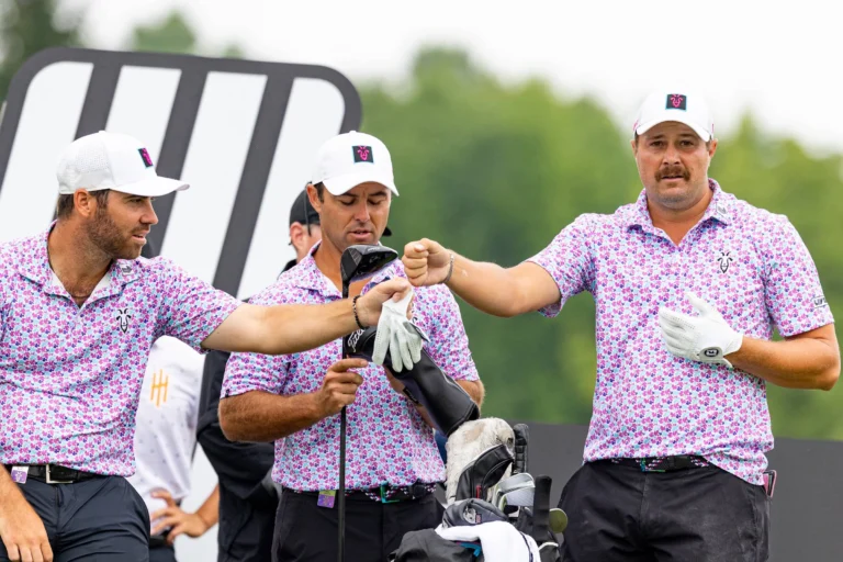 Peter Uihlein of RangeGoats GC fist bumps Matthew Wolff of RangeGoats GC