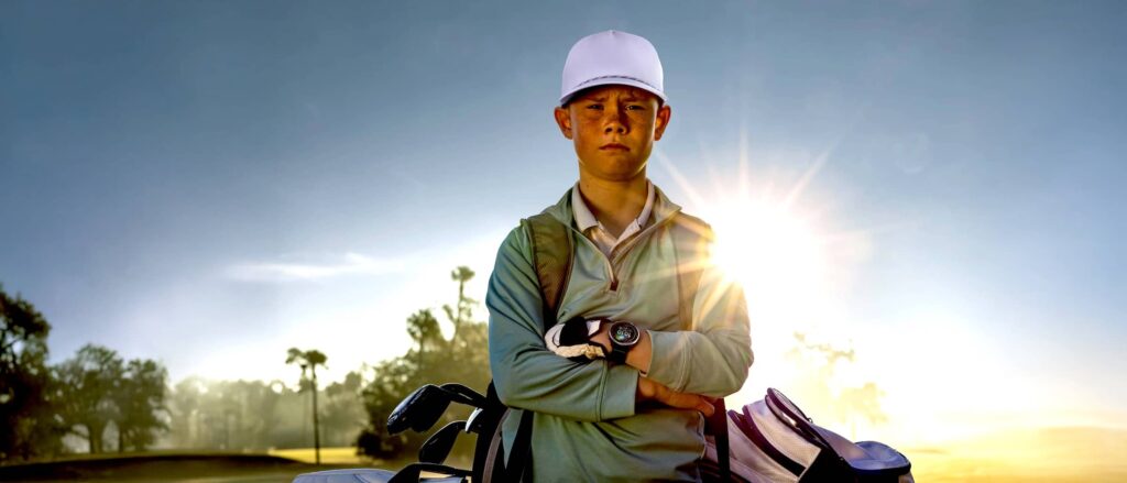 Young Golfer wearing Garmin Approach J1