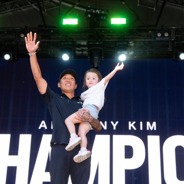First place individual champion, Anthony Kim of 4Aces GC celebrates with his daughter Bella during the trophy ceremony after the final round of the LIV Golf Adelaide at Grange Golf Club