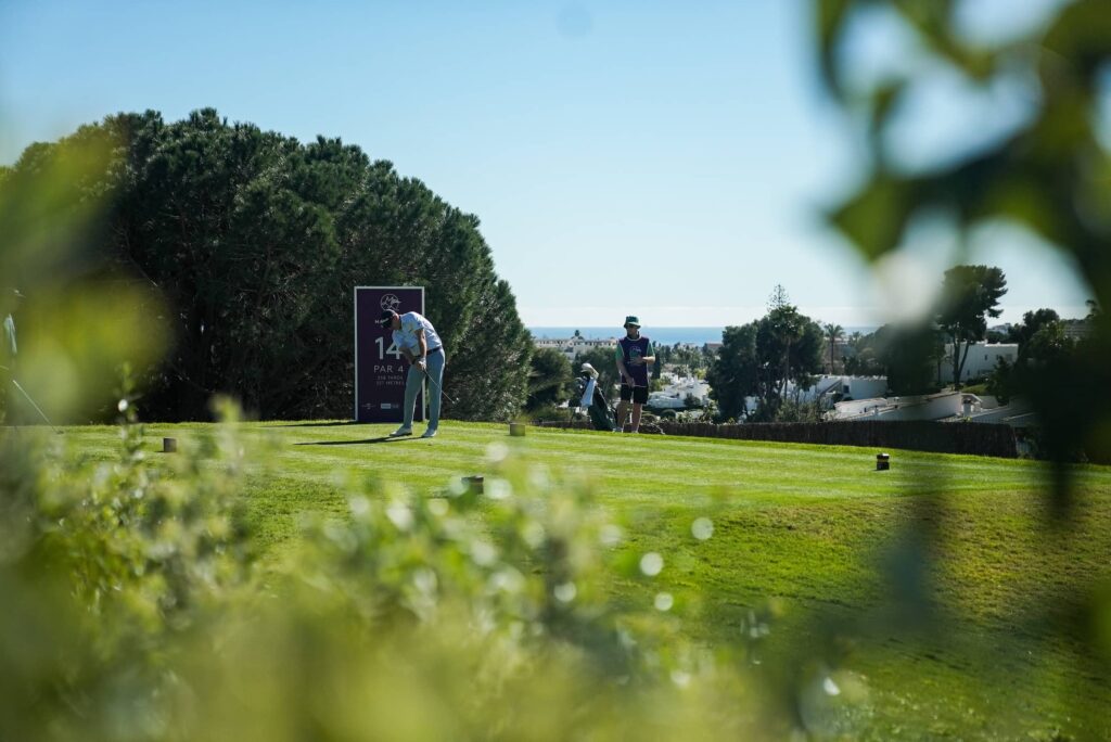 Stephen Gallacher takes second place, one shot behind at -12.