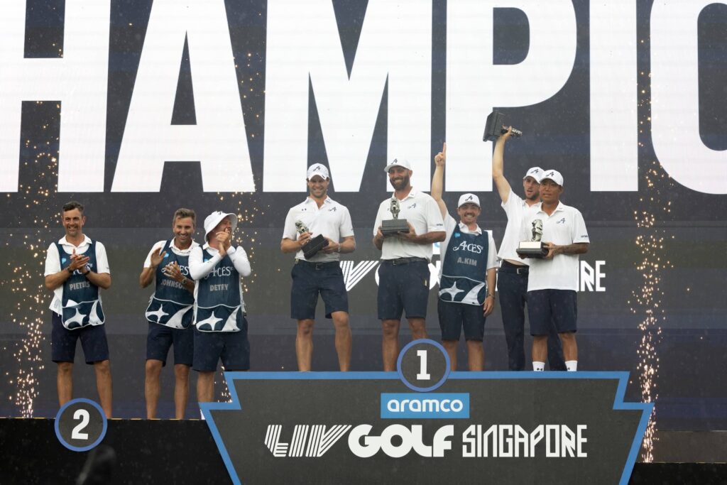 First place team champions, Captain Dustin Johnson, Thomas Detry, Anthony Kim and Thomas Pieters of 4Aces GC celebrate during the trophy ceremony after the final round of Aramco LIV Golf Singapore