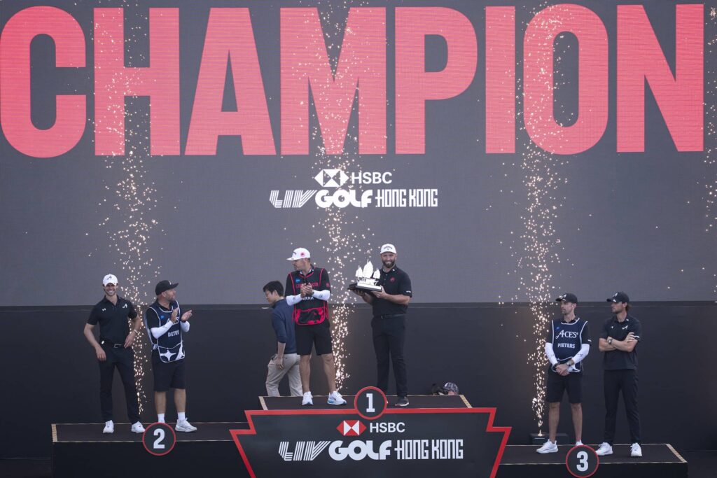 Captain Jon Rahm of Legion XIII receives the 2026 HSBC LIV Golf Hong Kong Individual Champion Trophy after the final round of HSBC LIV Golf Hong Kong