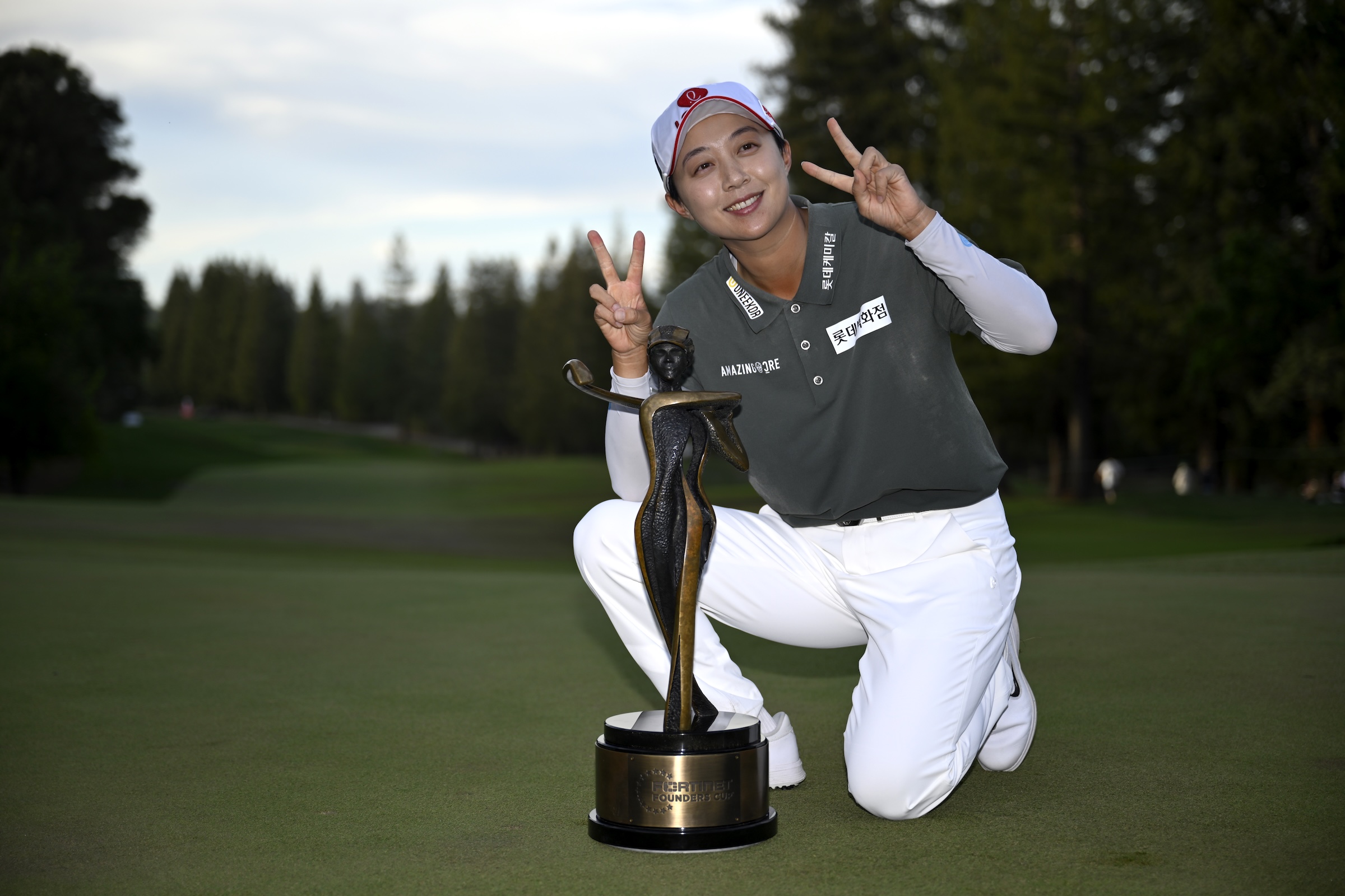 Hyo Joo Kim of Korea poses with the trophy after her winning putt on the 18th green during the final round of the Fortinet Founders Cup 2026 at Sharon Heights Golf and Country Club