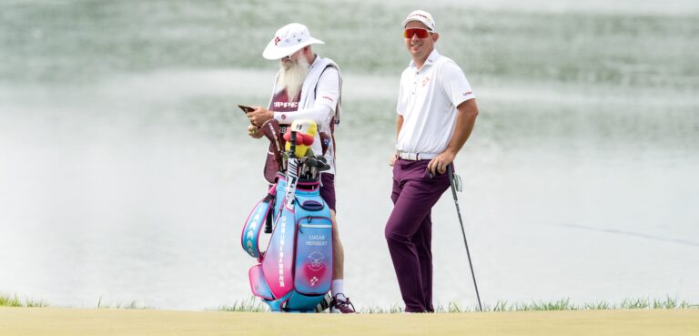 Lucas Herbert of Ripper GC and caddie, Nick Pugh on the eighth green during the third round of LIV Golf Virginia at Trump National Golf Club