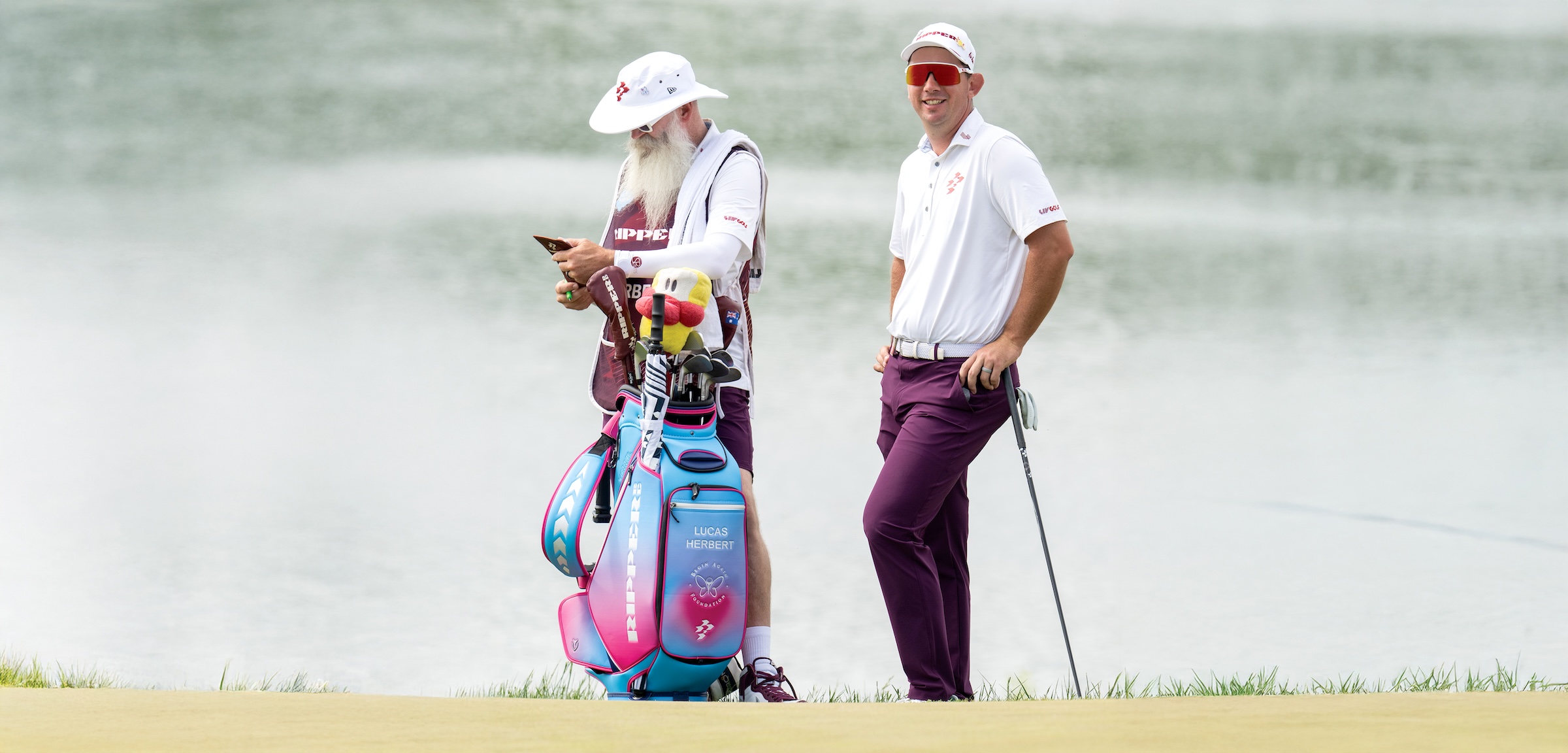 Lucas Herbert of Ripper GC and caddie, Nick Pugh on the eighth green during the third round of LIV Golf Virginia at Trump National Golf Club