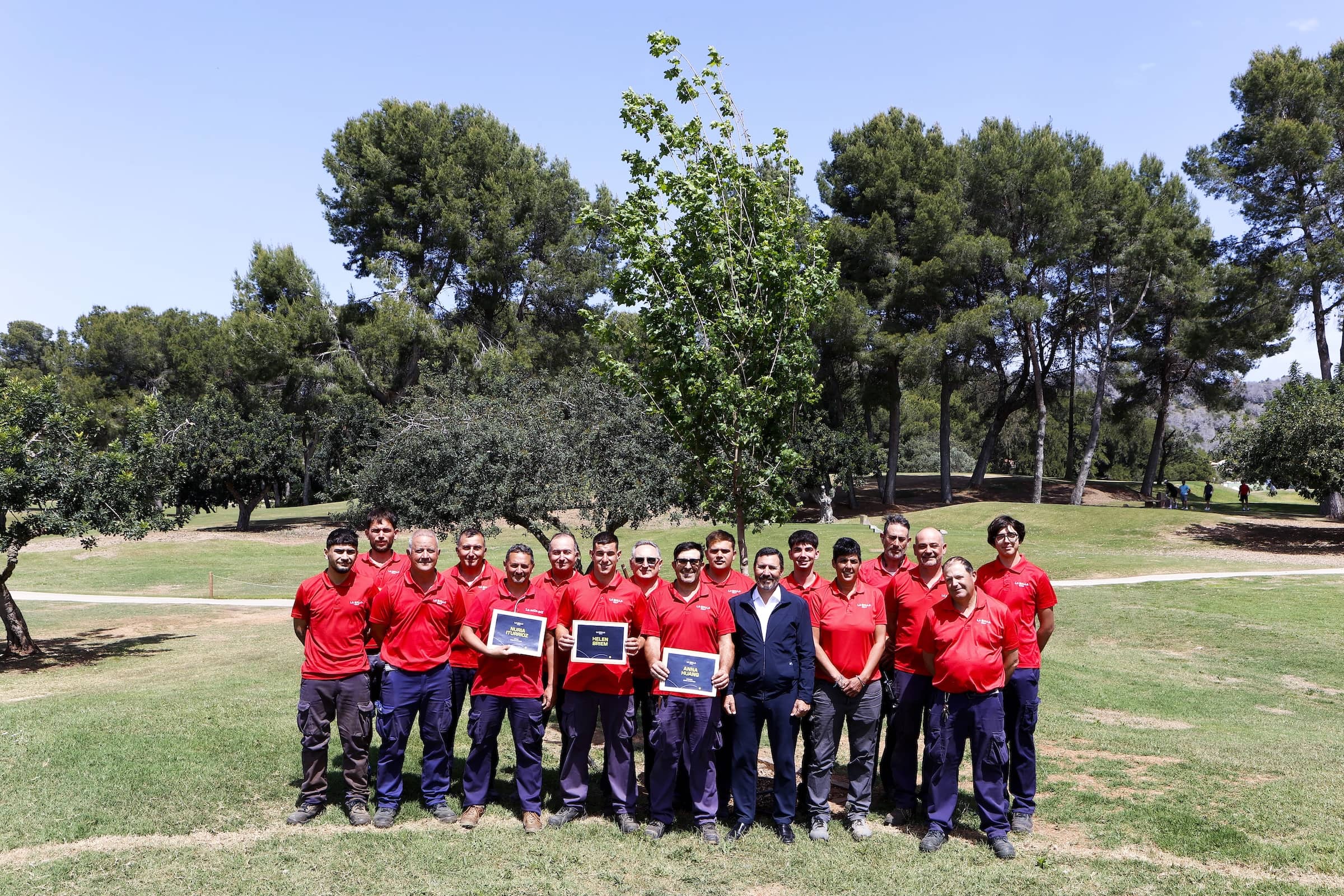 Carlos García, President of La Sella Golf, with the greenkeeping team after planting the first three trees of the Forest Champions.