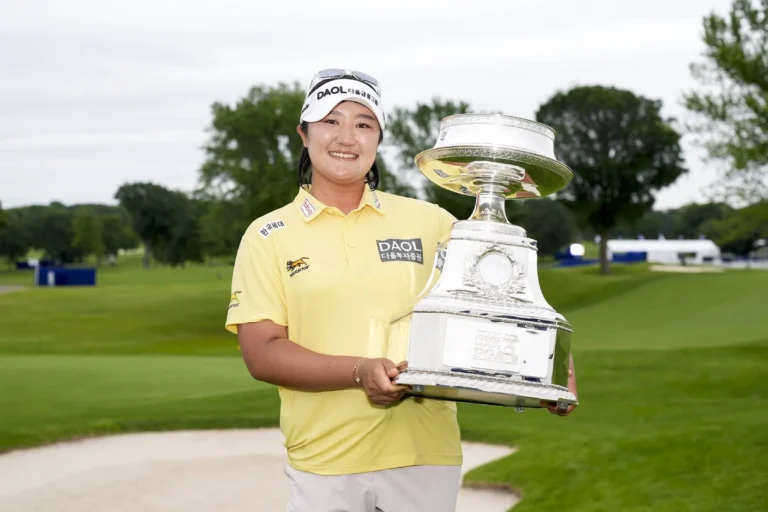 Haeran Ryu poses for a photo with the 2026 KPMG Women’s Championship trophy after the final round of the KPMG Women's PGA Championship at Hazeltine National Golf Club