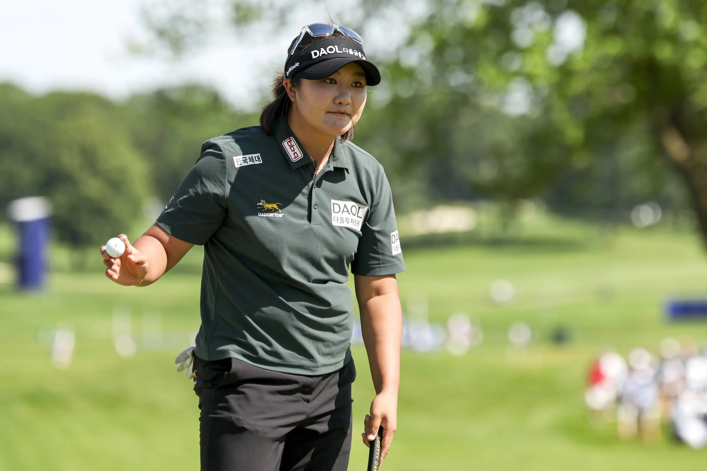 Haeran Ryu waves to the fans after her putt on the 18th green during the third round of the KPMG Women's PGA Championship
