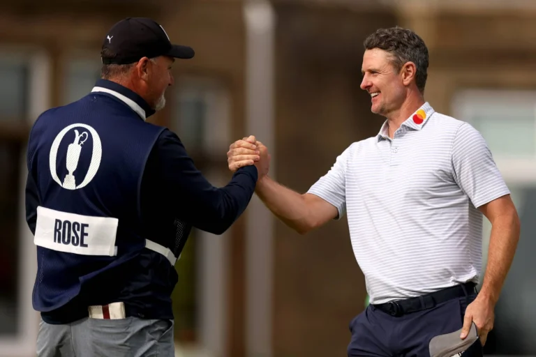 Justin Rose shakes hands with his Caddie